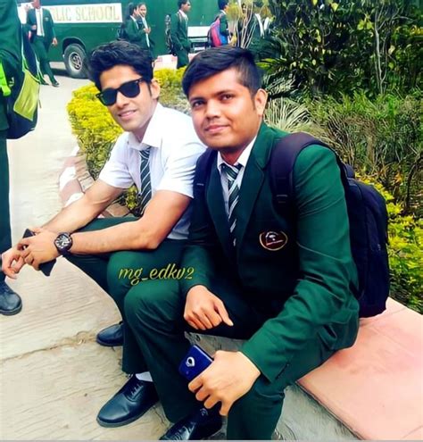 Two Men In Suits And Ties Sitting On A Bench