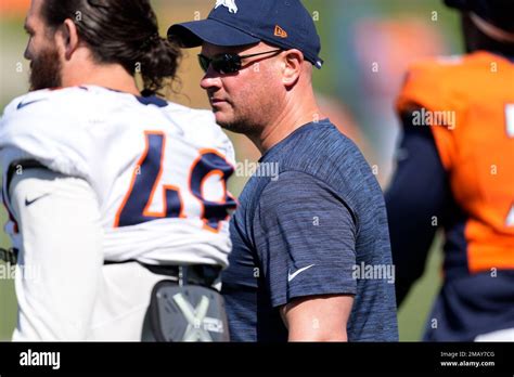 Denver Broncos Head Coach Nathaniel Hackett Takes Part In Drills During