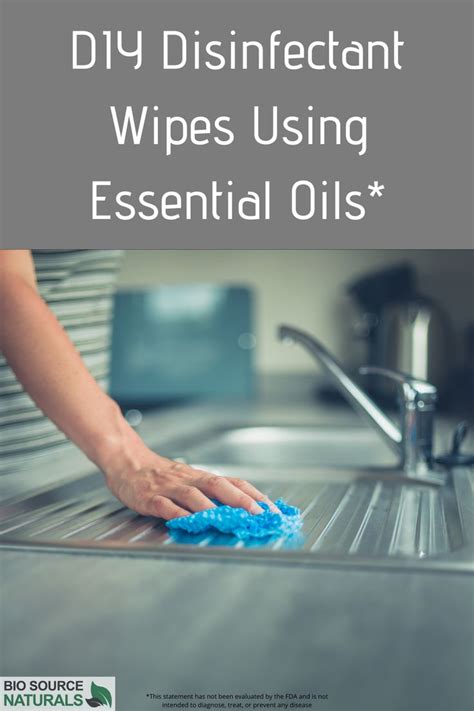 A Woman Is Washing Her Hands With A Blue Scrubber On The Kitchen