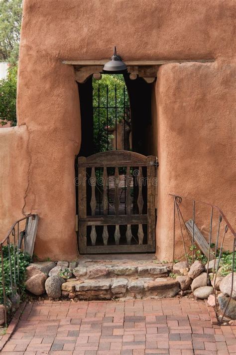 Rustic Gate At Entrance Through Adobe Wall In Santa Fe New Mexico