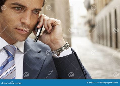 Businessman Using Mobilephone In Street Stock Photo Image Of