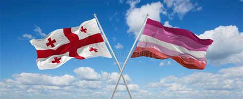 Two Crossed Flags Lesbian Pride And Georgia Waving In Wind At Cloudy