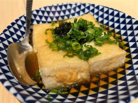 Premium Photo Warm Tofu With Spring Onion In Soy Sauce