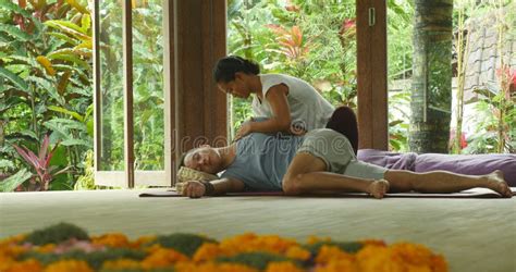 Young Beautiful And Exotic Asian Indonesian Therapist Woman Giving