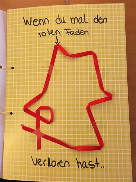 An Open Notebook With A Drawing Of A House In Red On Yellow Paper And