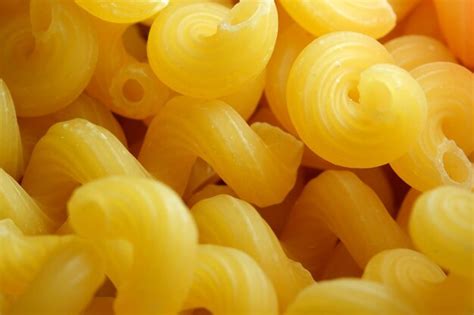 Premium Photo Grocery Yellow Background Large Raw Rolled Egg Pasta