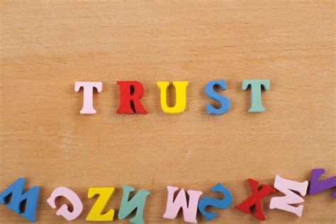 Trust Word On Wooden Background Composed From Colorful Abc Alphabet