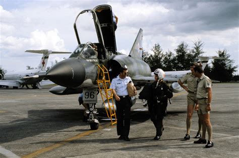 An Australian Pilot Is Welcomed By Officers Participating In Exercise