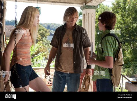 Left to right: Elle Fanning plays Alice Dainard, Ron Eldard plays Louis ...