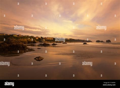 Spectacular Sunset Reflected In Water Bandon Beach Oregon Hi Res Stock