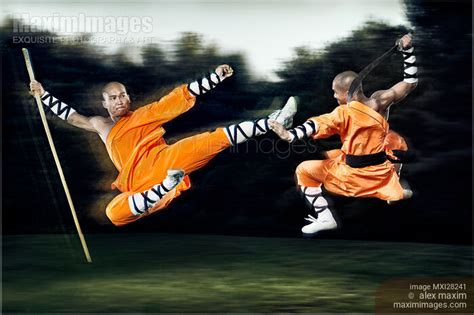 Photo of Two Shaolin monks fighting with weapons | Stock Image MXI28241