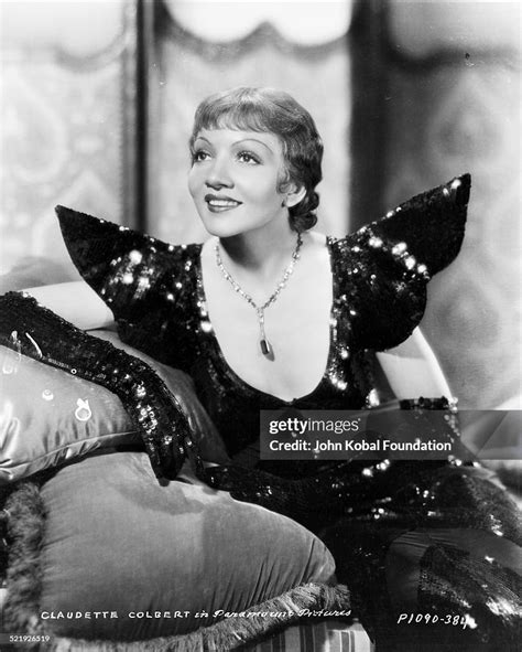 Portrait Of Actress Claudette Colbert Wearing A Glittery Gown For