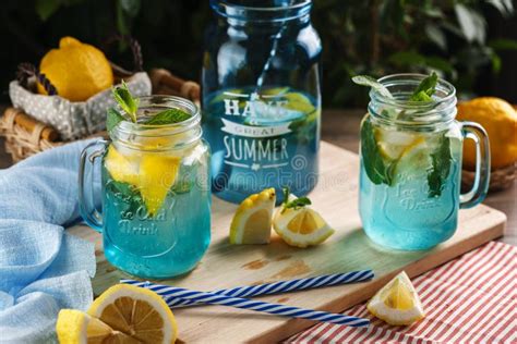 Citrus Lemonade Water With Lemon Sliced And Mint In Blue Jar Stock