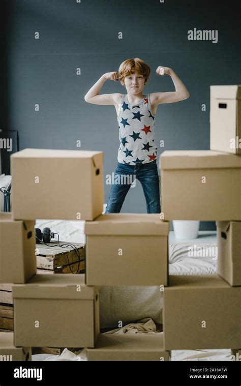 Portrait Of Boy Flexing Muscles Stock Photo Alamy
