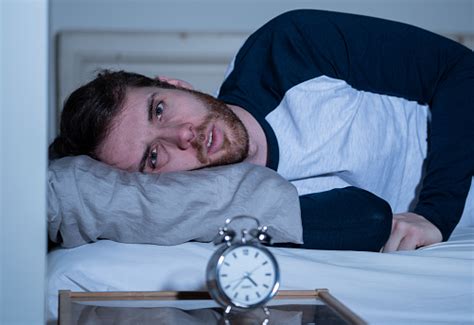 Sleepless And Desperate Young Caucasian Man Awake At Night Not Able To