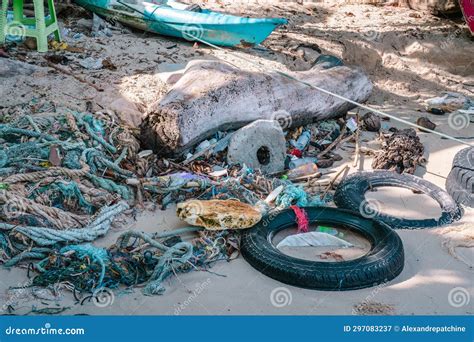 Different Kind Of Garbage At High Tide Water Line On Sand Beach Ropes