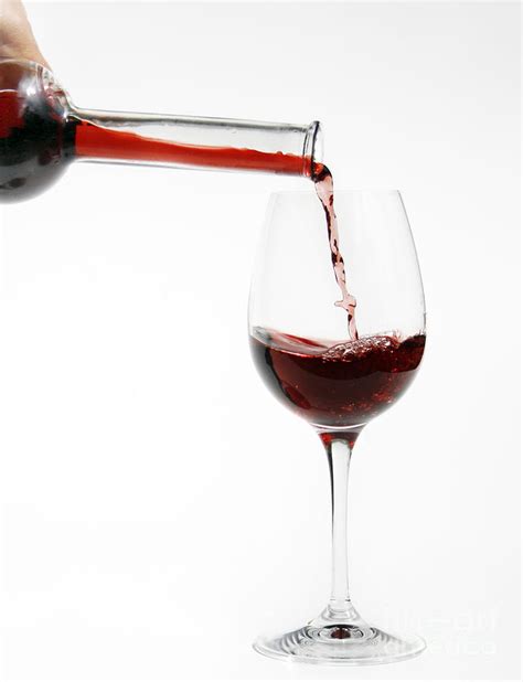 Pouring Red Wine Into Glass Photograph By Patricia Hofmeester