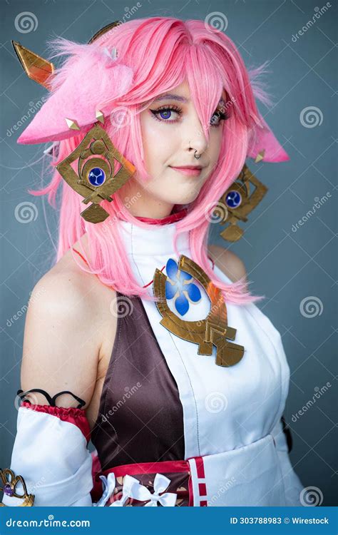 Female Cosplayer in a Pink Anime Costume Wearing Pink Hair Stock Image ...