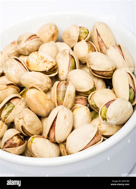 Pistachios In A White Bowl Close Up Stock Photo Alamy