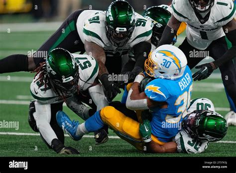 Los Angeles Chargers Running Back Austin Ekeler 30 Is Tackled By The