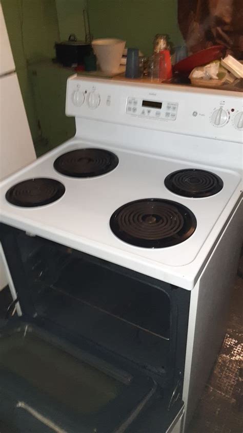 Ge Profile True Temp Electric Stove For Top Burners And Brand New Oven