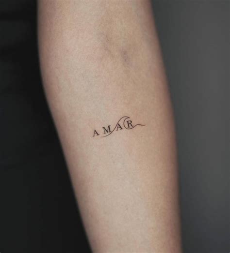 Amar Lettering Tattoo On The Inner Forearm