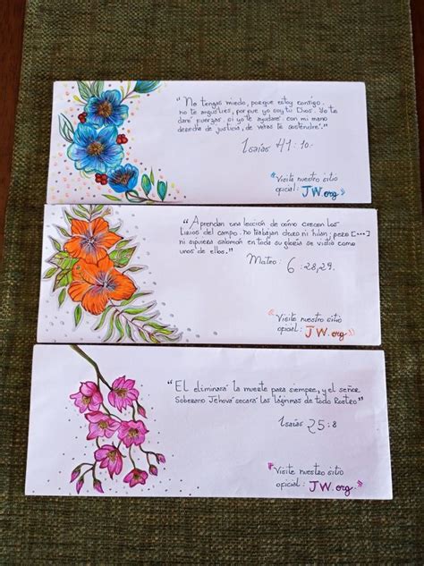 Three Envelopes With Colorful Flowers On Them