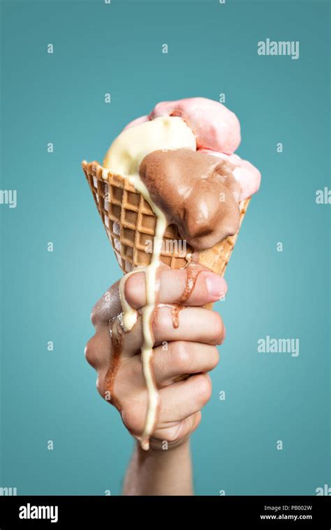 Woman Holding Melting Ice Cream Cone By Walker And Walker