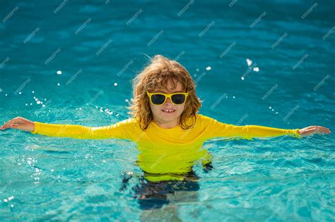 Premium Photo | Kid enjoying summer holiday swiming in pool kid having ...