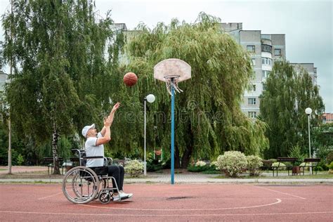 Dad Plays With His Disabled Son On The Sports Ground Concept