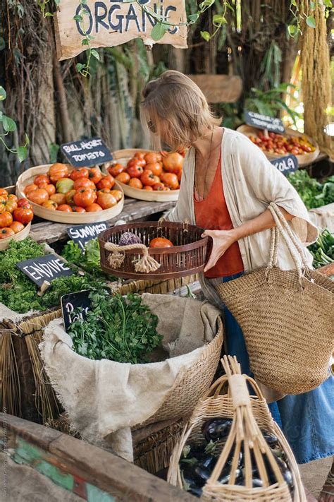 Woman Shopping Organic Food In A Farmer Market By Stocksy Contributor Alexander Grabchilev