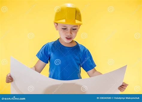 A Little Boy Holding Plan Project In His Hands Dreams Of Becoming A