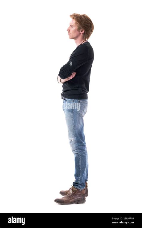 Young Red Hair Man With Crossed Arms Looking Away Watching Interested