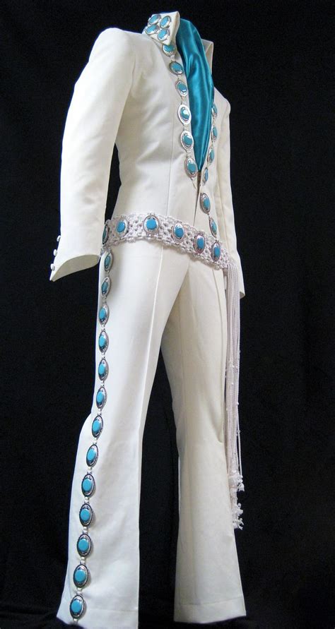 A White Suit With Blue Beads On It