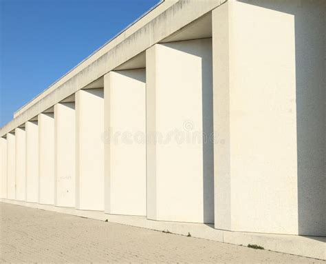 Modern White Stone Colonnade With Tiled Pavement In Front Stock Image