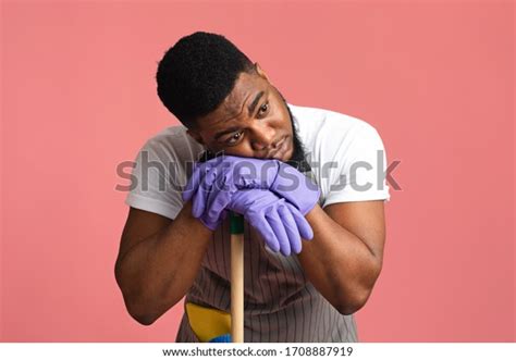 Exhausted Black Guy Leaning On Mop Stock Photo 1708887919 Shutterstock