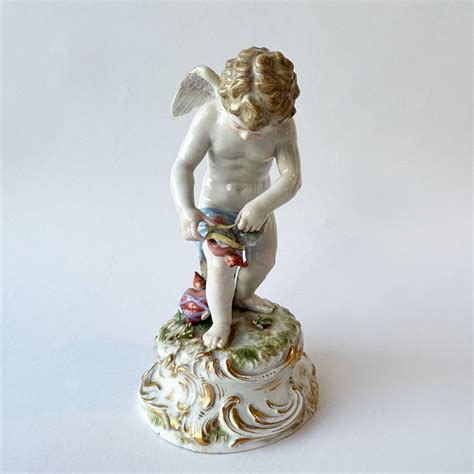 Meissen Porcelain Figure Of Cupid Binding A Heart