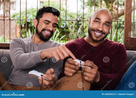 Fun Gay Couple Playing Video Game In The Sofa Stock Image Image Of