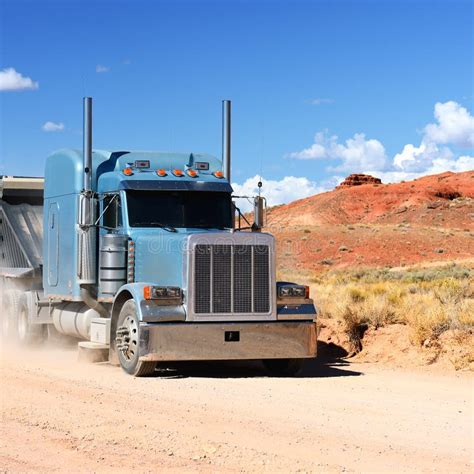 Semi Truck Driving Across The Desert Royalty Free Stock Photography