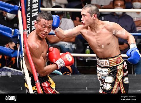 Andy Hiraoka Red Gloves And Jin Sasaki Blue Gloves Compete During