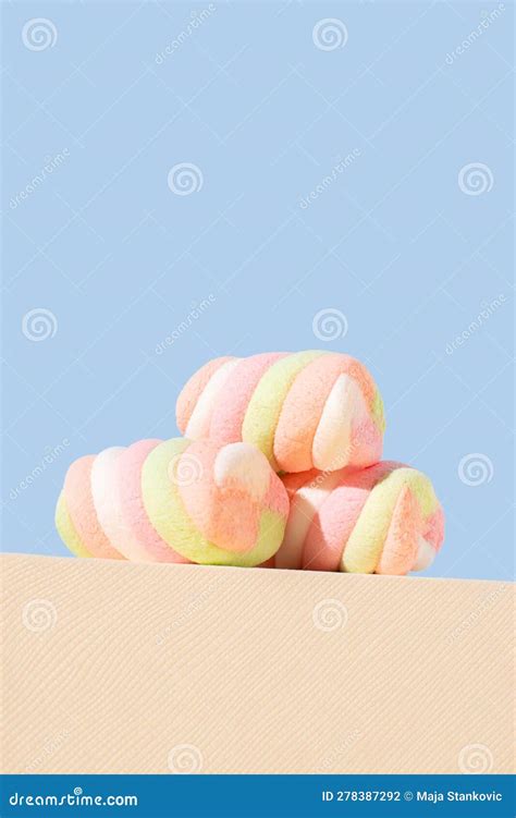 Marshmallows In Pastel Color On White And Blue Background Candy