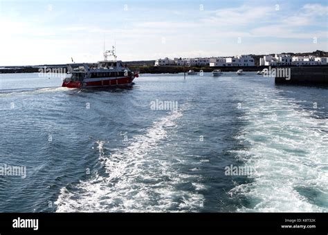 Tourist Ferry Boat Arriving In Orzola Harbour From La Graciosa