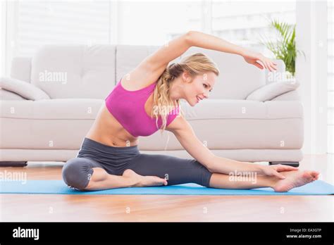 Fit Blonde Stretching On Exercise Mat Stock Photo Alamy