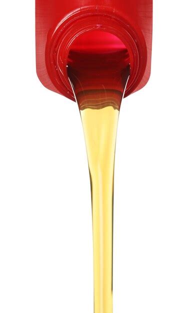 Premium Photo Pouring Motor Oil From Red Container Isolated On White