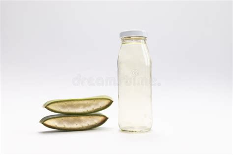 Aloe Vera Plant And Glass Bottle Of Aloe Vera Juice Drink On Gray