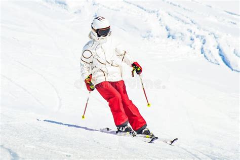 Alpine Ski Skiing Woman Skier Going Downhill Against Snow Covered