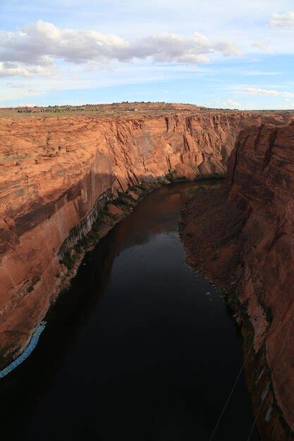 Premium Photo High Angle View Of River Amidst Rocky Cliffs