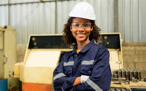 Smiling Portrait Of Confident Engineer Worker With Arm Crossed At