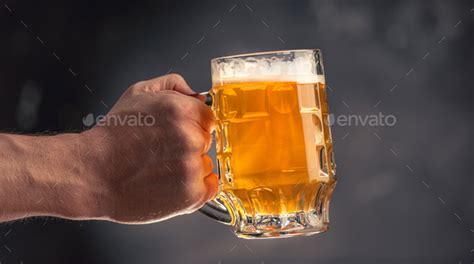 Hand Holding Beer Mug Stock Photo By Tan4ikk Photodune