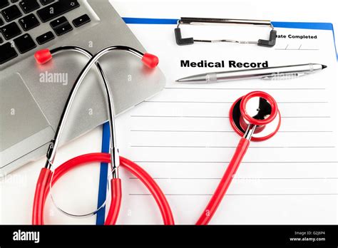 Red Stethoscope On Blue Clipboard With Medical Record Close Up With